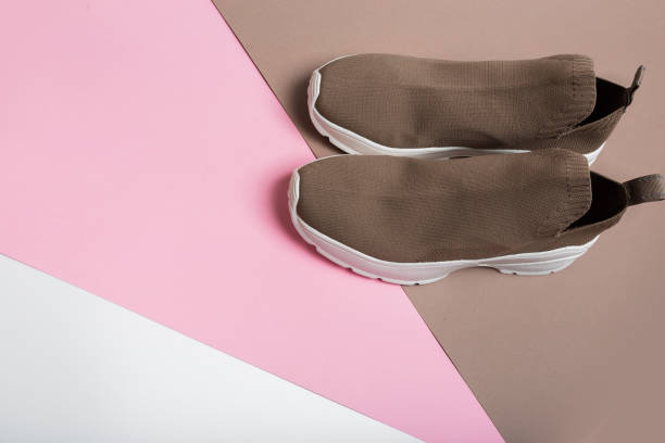 istock modern beige sneakers with white soles on multicolour background 1314716440