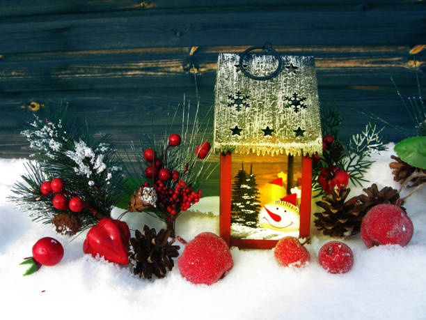 istock christmas lantern fruit berries apple and decoration with fir branches snow 1314717033