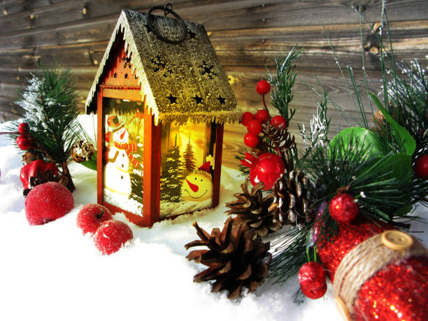 istock christmas lantern fruit berries apple and decoration with fir branches snow 1314717197