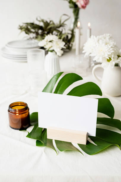 istock Mock up table tent, menu or stand for booklet on tropical leaf on restaurant table 1314719007