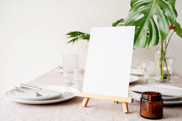 istock Mock up table tent, menu or stand for booklet on restaurant table with tropical bouquet 1314719514