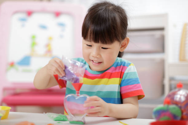 istock Young Girl Making Sands Craft At Home 1314722886