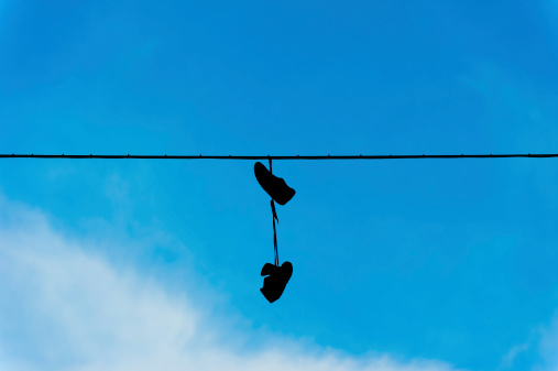 Shoes hanging from power line