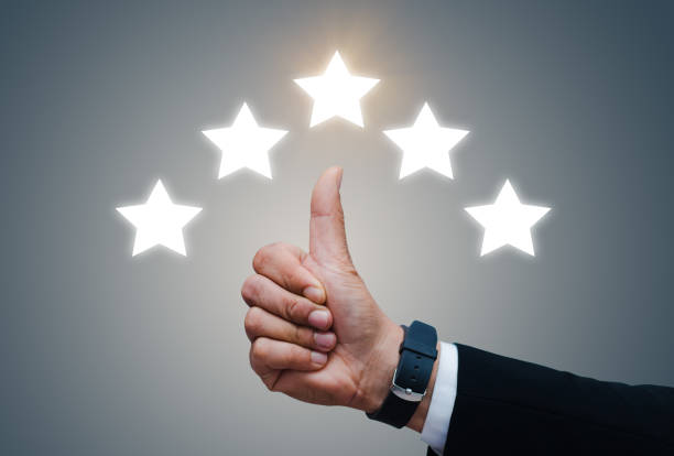 istock Hand of client show thumb up with five star rating. 1314723966