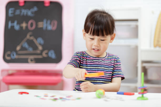 istock Young Girl Playing Science Experiment At Home 1314723988