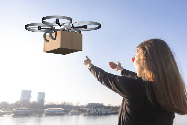 istock drone delivery parcel sent by young woman 1314725353