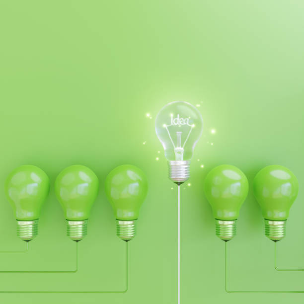 istock Energy saving light bulb on green Background with idea concept. 1314725781