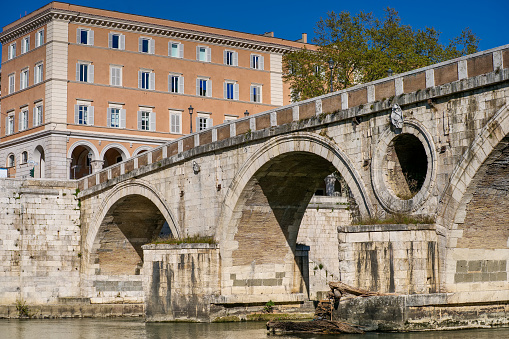 A detailed view of Ponte Sisto along the banks of the River Tiber in the ancient Trastevere district. This bridge was rebuilt on a Roman structure at the behest of Pope Sixtus IV. Trastevere is one of the most iconic district of the eternal city, for the presence of monuments and ancient churches, but also for small squares and alleys where it is easy to find typical restaurants, pubs and little store. Image in High Definition Format.