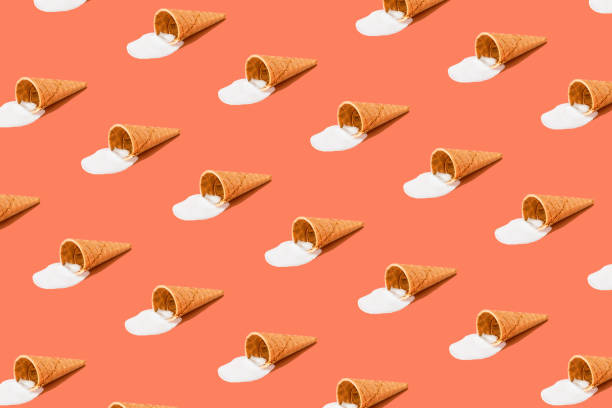 istock A cone with melted ice cream on a bright red background. Minimalistic summer food concept 1314728728