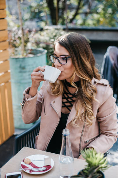 istock Woman drinking coffee in a cafe 1314729987