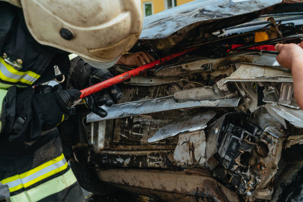 istock Rescuers rescue victims from a wrecked car 1314730071