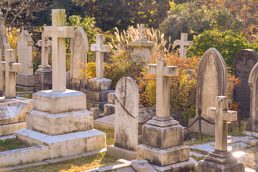 Ancient cemetery white marble crosses  in the sunlight in Lugo city, Galicia, Spain.