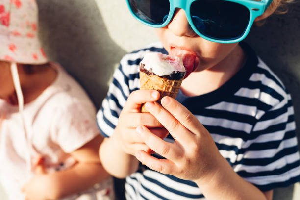 istock Girl And Boy Eating Ice Cream 1314733219