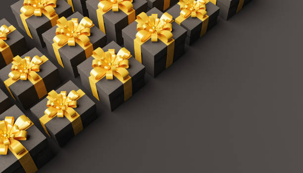 istock dark gift boxes with gold ribbons lined in the corner 1314734721