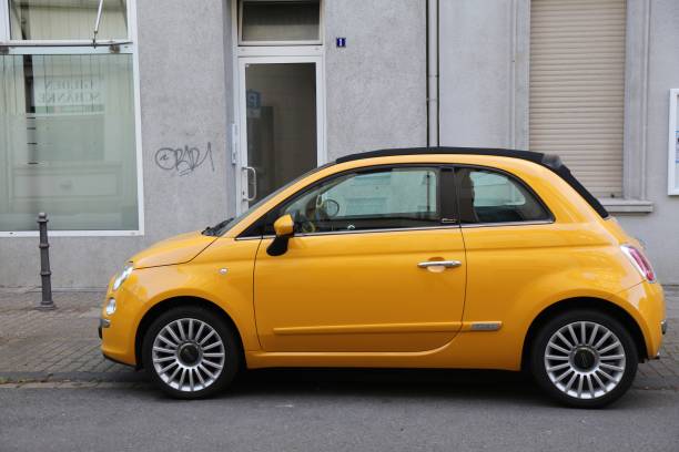Fiat 500 small city car parked in Germany. There were 45.8 million cars registered in Germany (as of 2017).