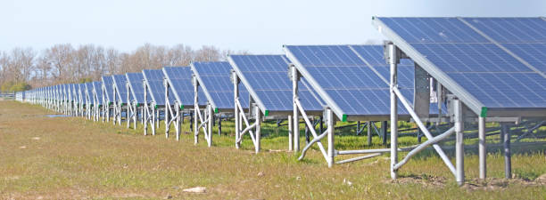 istock Solar park, green energy panels on grass 1314737100