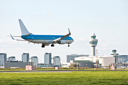 KLM Boeing 737-800 airplane landing at Schiphol airport on the Polderbaan. KLM Royal Dutch Airlines (Koninklijke Luchtvaart Maatschappij) part of Air France–KLM has its home base at Schiphol Amsterdam airport.