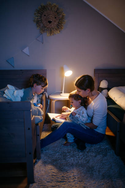 istock Young mother reading a bedtime story 1314737660