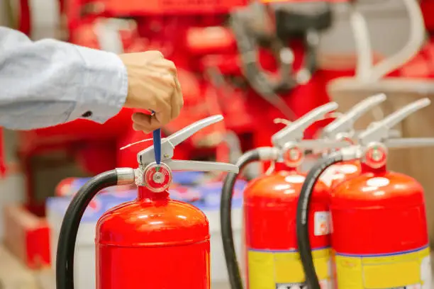 Engineer inspection Fire extinguisher and fire hose,Ready to use in the event of a fire.Safety first concept.