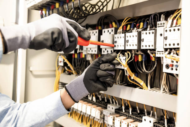 istock Electricians work to connect electric wires in the system, switchboard, electrical system in Control cabinet. 1314737999