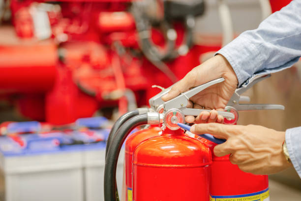 istock Engineer inspection Fire extinguisher and fire hose,Ready to use in the event of a fire.Safety first concept. 1314738569