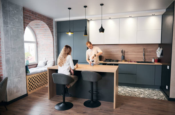istock Family in modern kitchen having tea after work. 1314741143