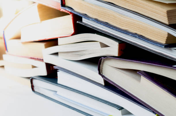 Stack of hardcover books on white background