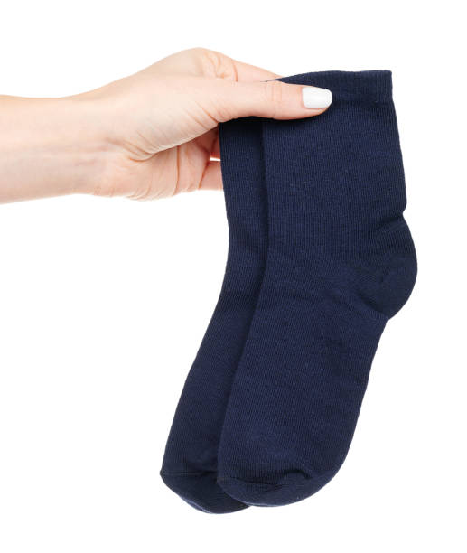 istock Hand wtih dark blue cotton socks isolated on white background 1314742934
