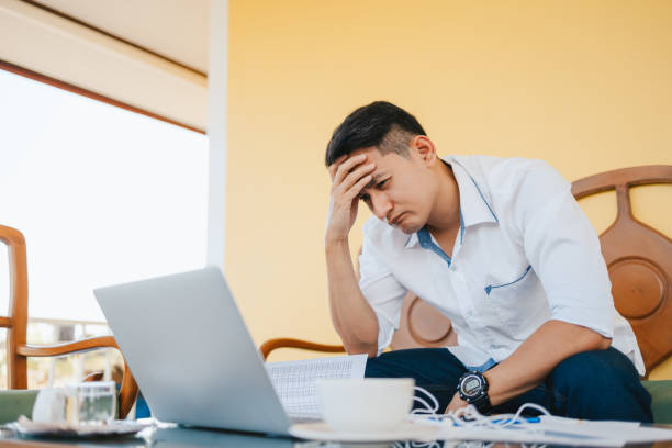 istock Tired businessman at workplace in office holding his headache or angry. Overworking, making mistake, stress, termination, fail, bad, sad tired or depression concept 1314742956