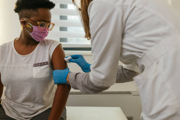 istock Doctor disinfecting an arm before injection 1314743348