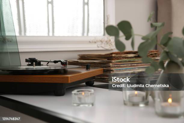 Stylish Turntable With Vinyl Record On Table Indoors Stock Photo - Download Image Now