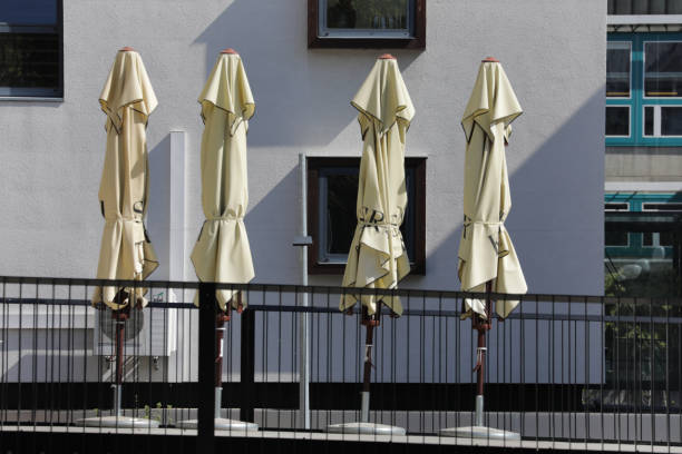 istock four sunshades on a terrace 1314749390