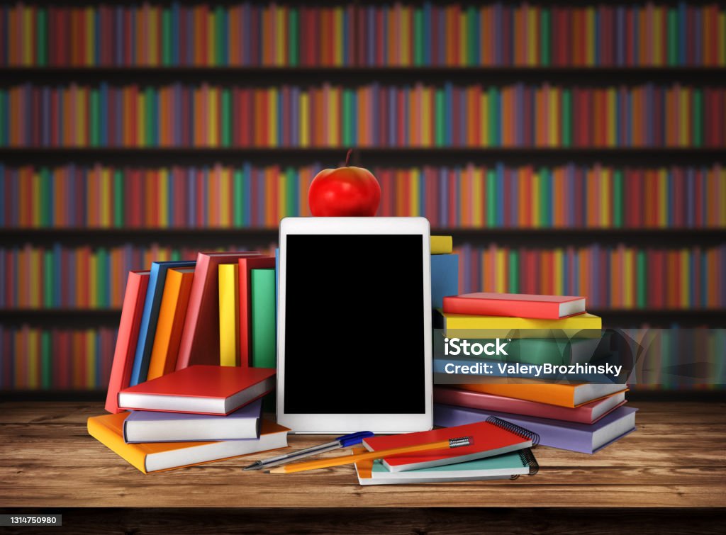 Wooden table with a stack of colored books, tablet, pencil, school supplies, apple. Education concept, back to school. Blurred background from book shelves. Table top with books in library. 3d render Back to School Stock Photo