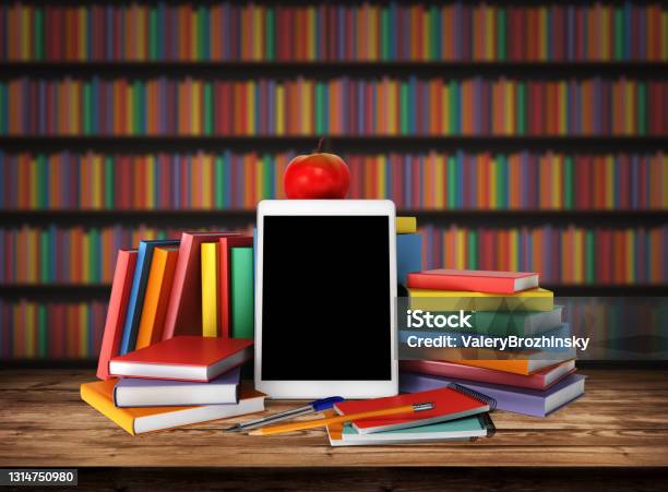 Wooden Table With A Stack Of Colored Books Tablet Pencil School Supplies Apple Education Concept Back To School Blurred Background From Book Shelves Table Top With Books In Library 3d Render Stock Photo - Download Image Now