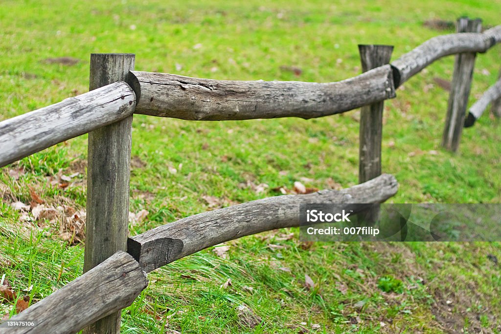 Old wooden fence Old wooden fence on the farm Agricultural Field Stock Photo