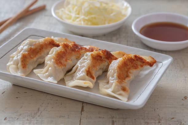 istock Fried dumplings Gyoza on plate and soy sauce 1314753923