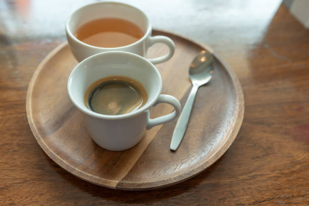 istock Coffee in a white cup on a wooden table 1314755840