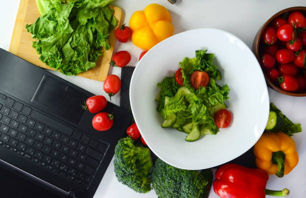 istock summer vegetables, cooking food courses online with laptop 1314757635