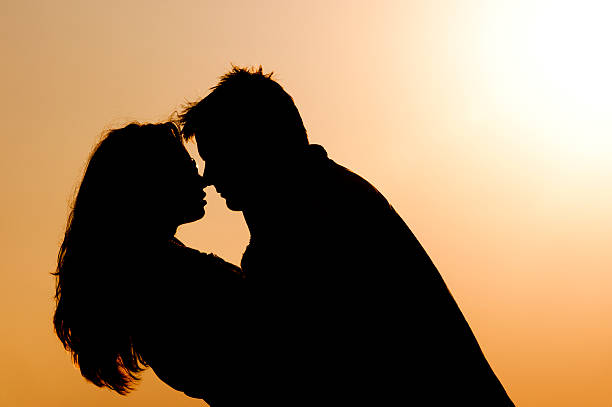 istock silhouette young couple in love 131475862