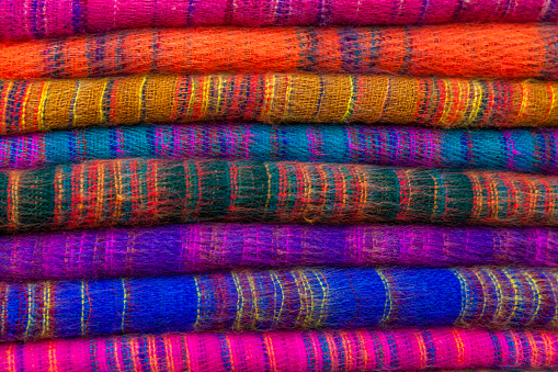 Colourful pashmina shawls for sale on nepali street market, Asia.
