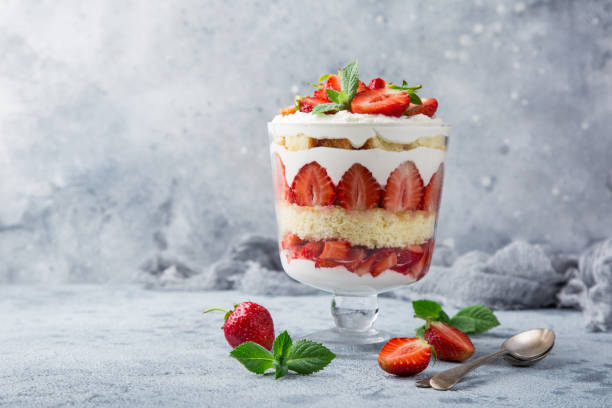 Strawberry trifle. layered dessert with fresh berry and cream cheese Strawberry trifle. layered dessert with fresh berry and cream cheese, selective focus trifle stock pictures, royalty-free photos & images