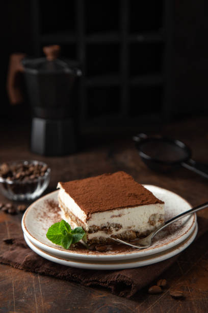istock Tiramisu. Traditional italian dessert on white plate 1314761085