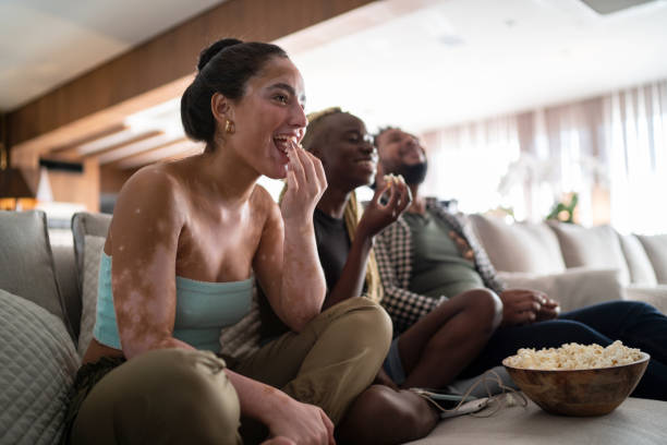 istock Friends together watching tv at home 1314761206