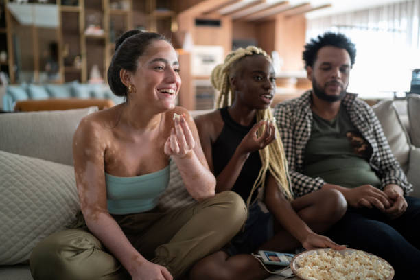 istock Friends together watching tv at home 1314761303