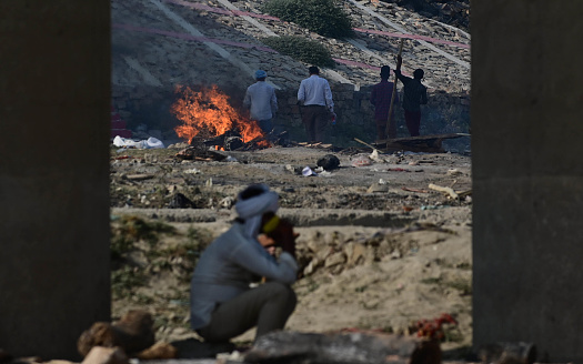 Prayagraj: Burning funeral pyres can be seen of the patients who died of the Covid-19 coronavirus at Phaphamau Ghat in Prayagraj on April 27, 2021.