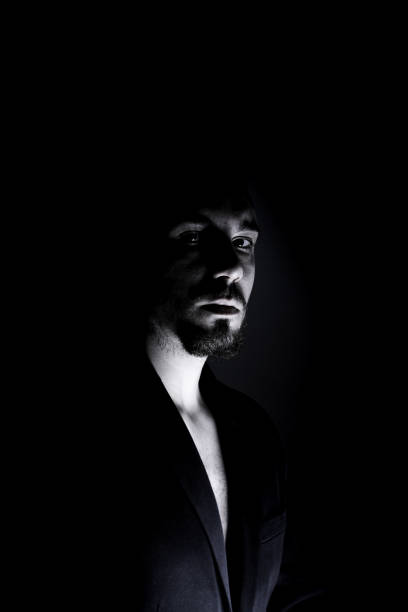istock Vertical portrait of sadness model man on black background 1314762108