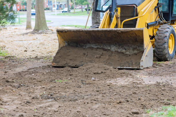 istock Bulldozer moving, leveling ground at construction site 1314763683
