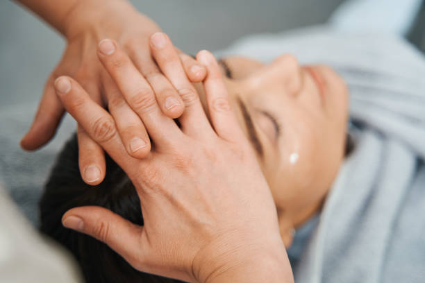 istock Dark-haired lady lying with closed eyes during a scalp massage 1314766566