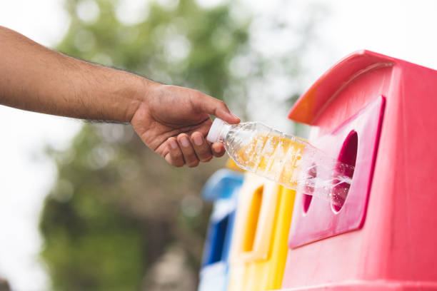 istock A young man drinks from plastic bottles and throws them into the trash. Video about environmental day Separate plastic waste in the correct category. Public trash 1314767353