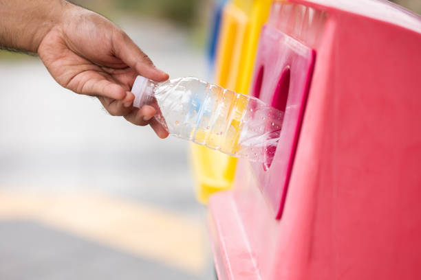 istock A young man drinks from plastic bottles and throws them into the trash. Video about environmental day Separate plastic waste in the correct category. Public trash 1314767393